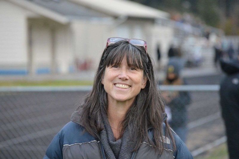 Woman with brown hair. Coordinator for the Master Gardener Program